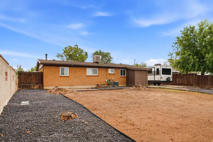 Brick residence with expansive grounds featuring newly seeded backyard, and RV parking