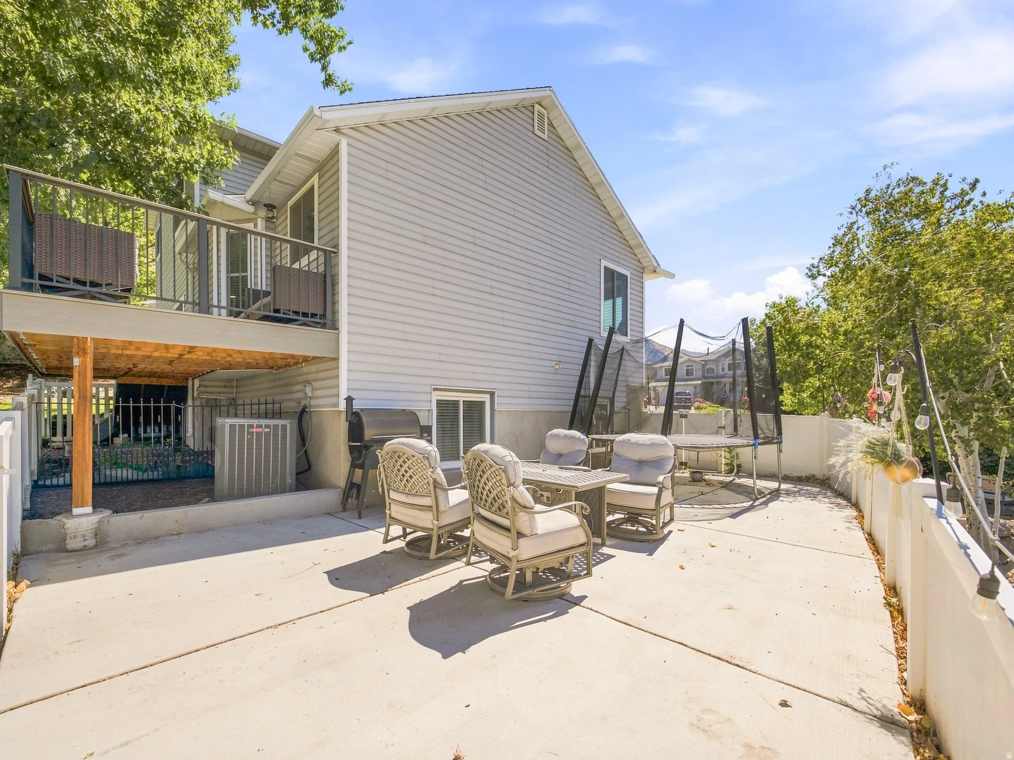 Concrete patio with a composite deck overhead