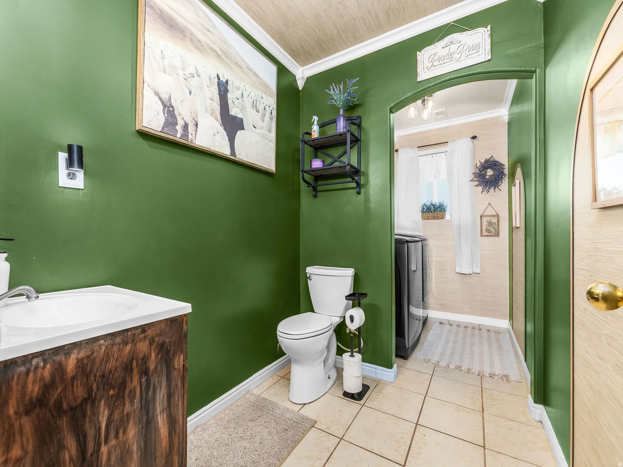 Wood-finish vanity with an integrated white sink and chrome faucet