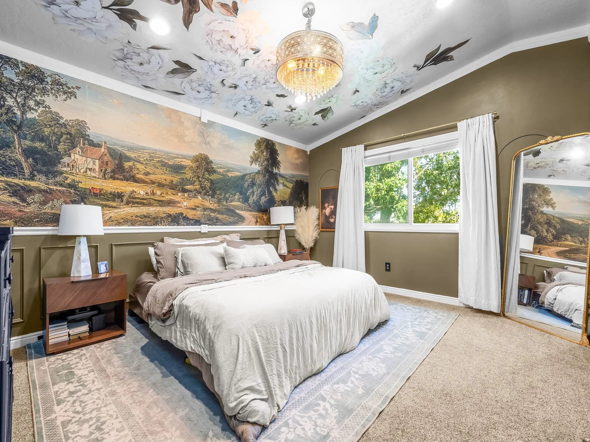 Master bedroom. Decorative wall mural, ceiling accent, recessed lighting, double-paned window, and a chandelier fixture