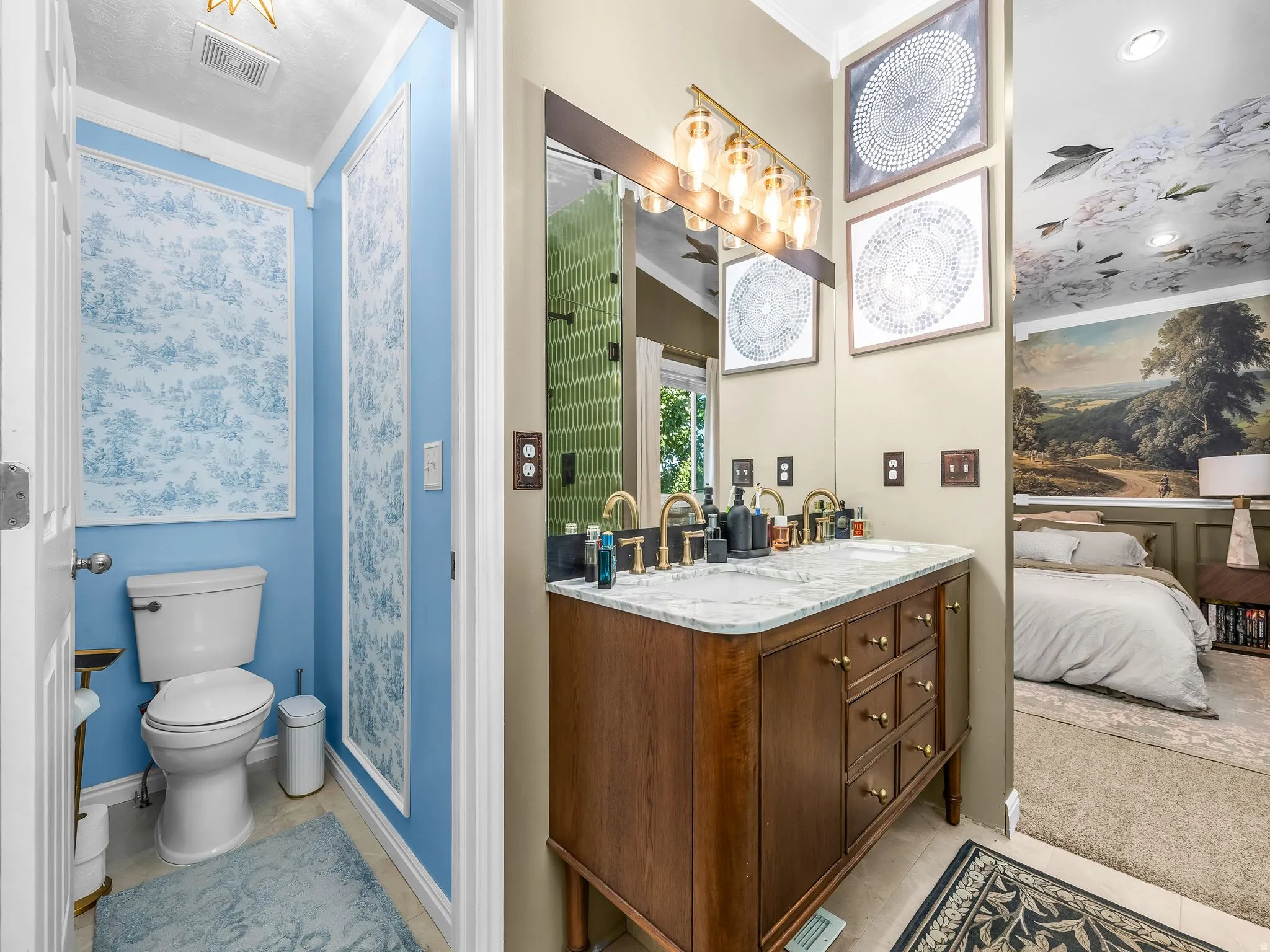 Double vanity with a stone countertop and gold-tone fixtures