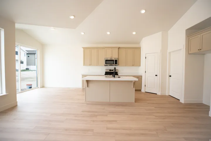 Dining area adjacent to kitchen with 8' sliding glass door.