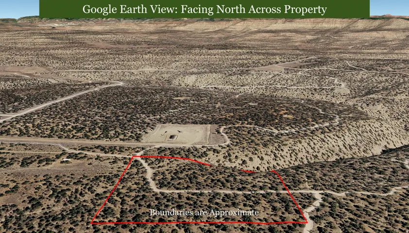 Expansive desert landscape with natural vegetation and unpaved access paths