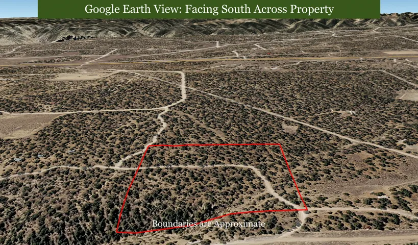Expansive land parcel with surrounding natural terrain