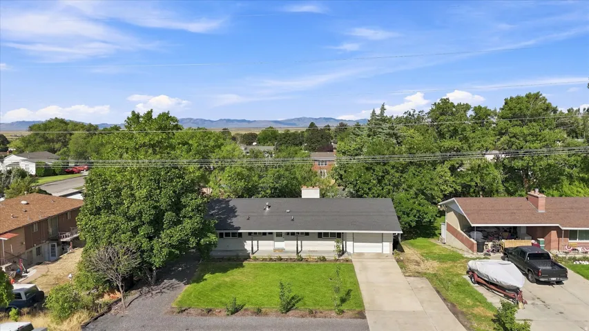 Single-story residence with a concrete driveway and an attached garage