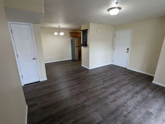 Wood-finish flooring throughout, with a neutral wall color palette