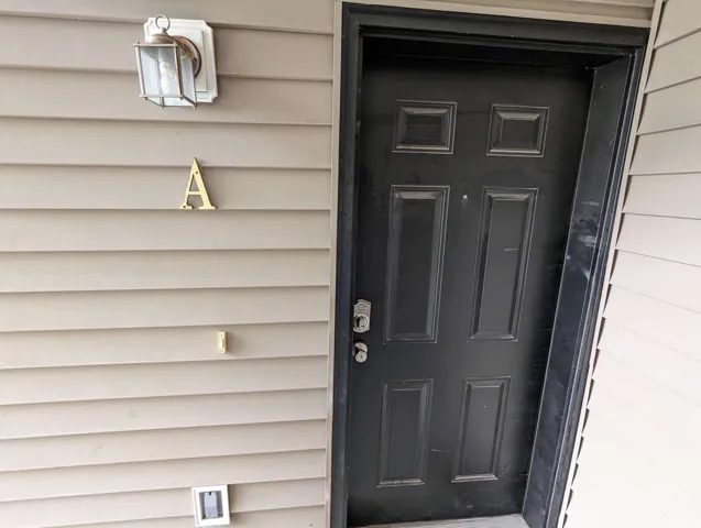 Panel-style entry door with a deadbolt and doorknob