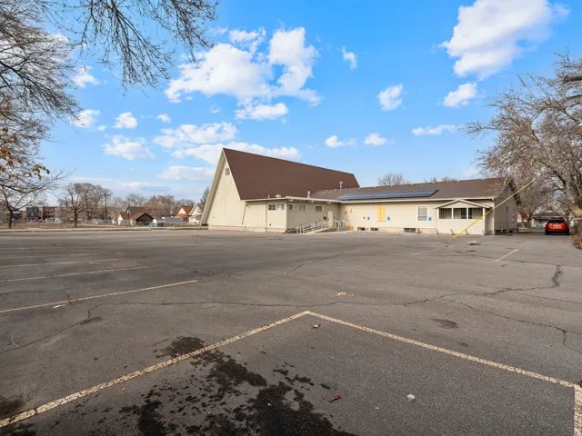 Expansive asphalt parking lot with painted parking lines
