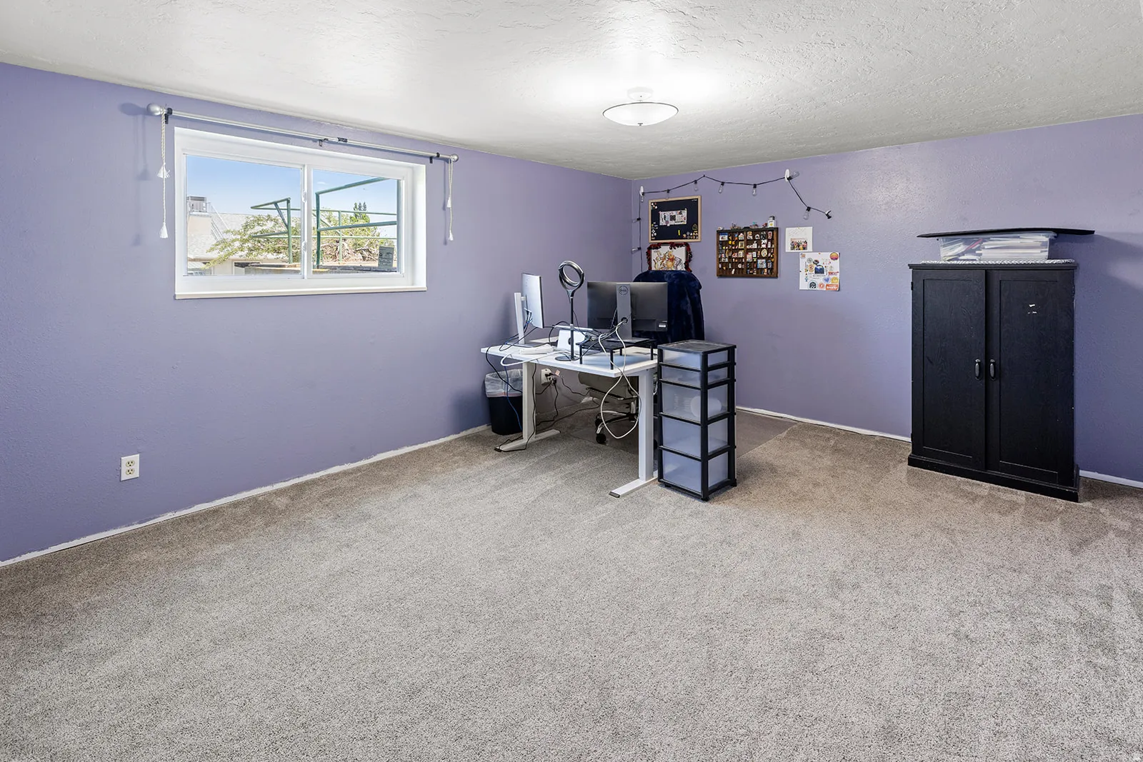 Carpeted flooring, recessed window, and overhead lighting