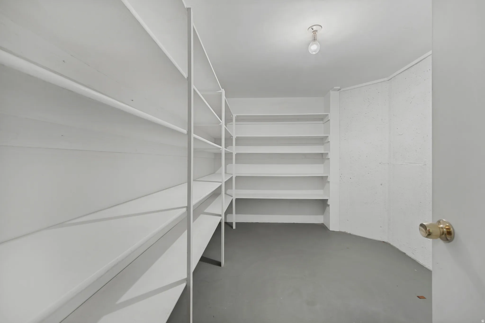 Extensive built-in shelving, durable flooring, and recessed ceiling lighting