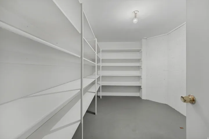 Extensive built-in shelving, durable flooring, and recessed ceiling lighting