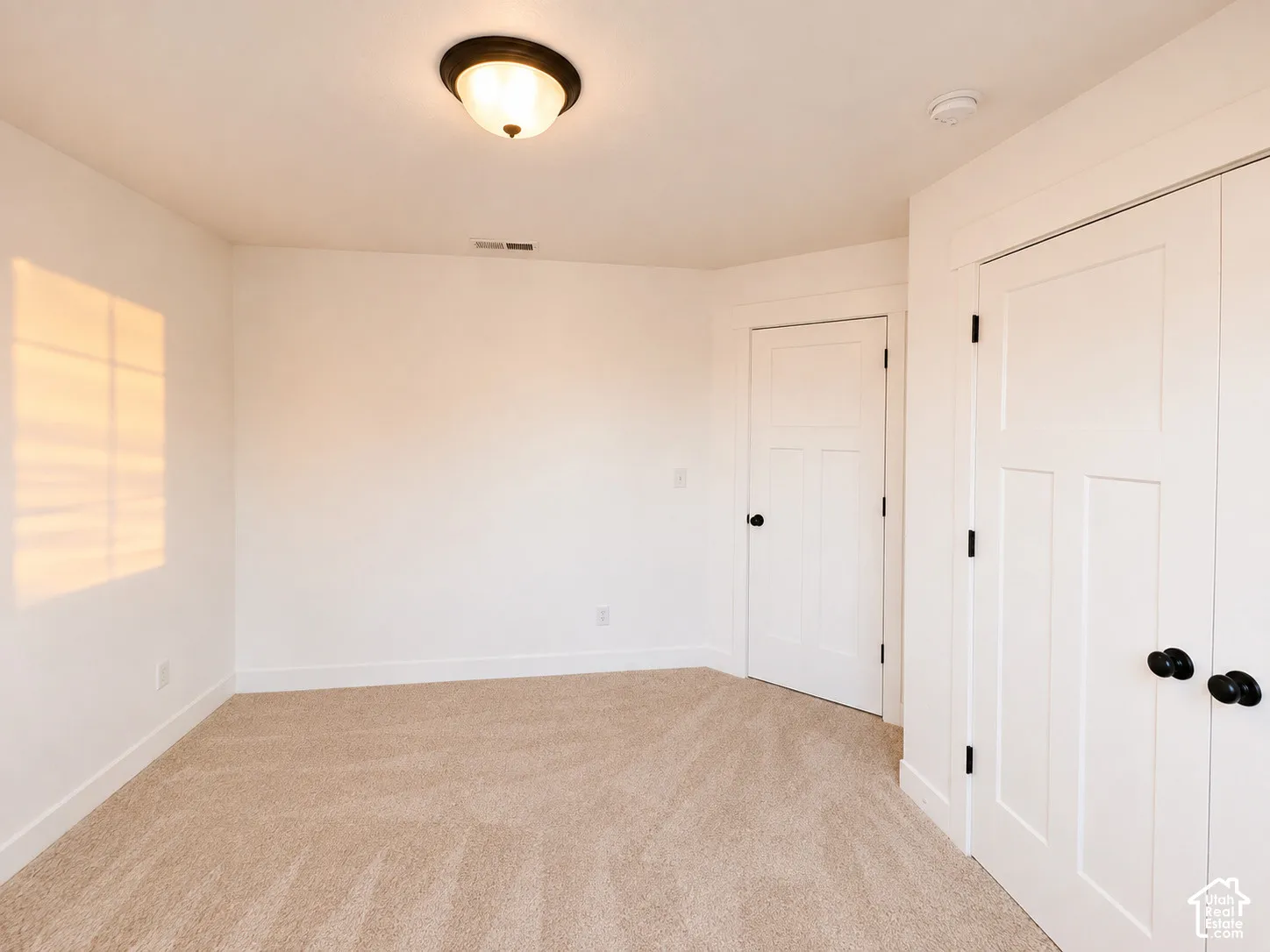 Neutral tone wall-to-wall carpeting