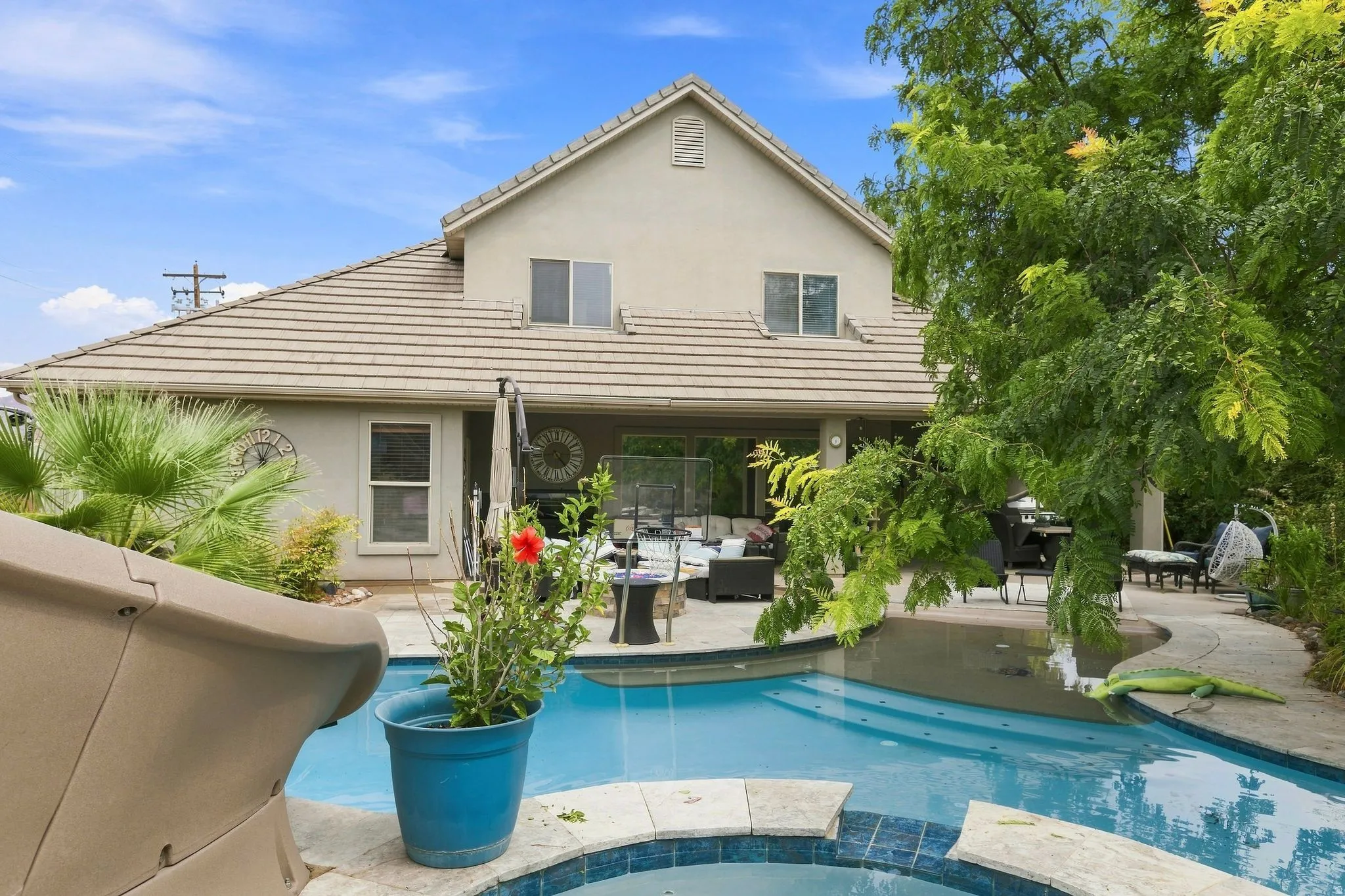 Rear exterior showcasing a multi-level design with a tiled roof