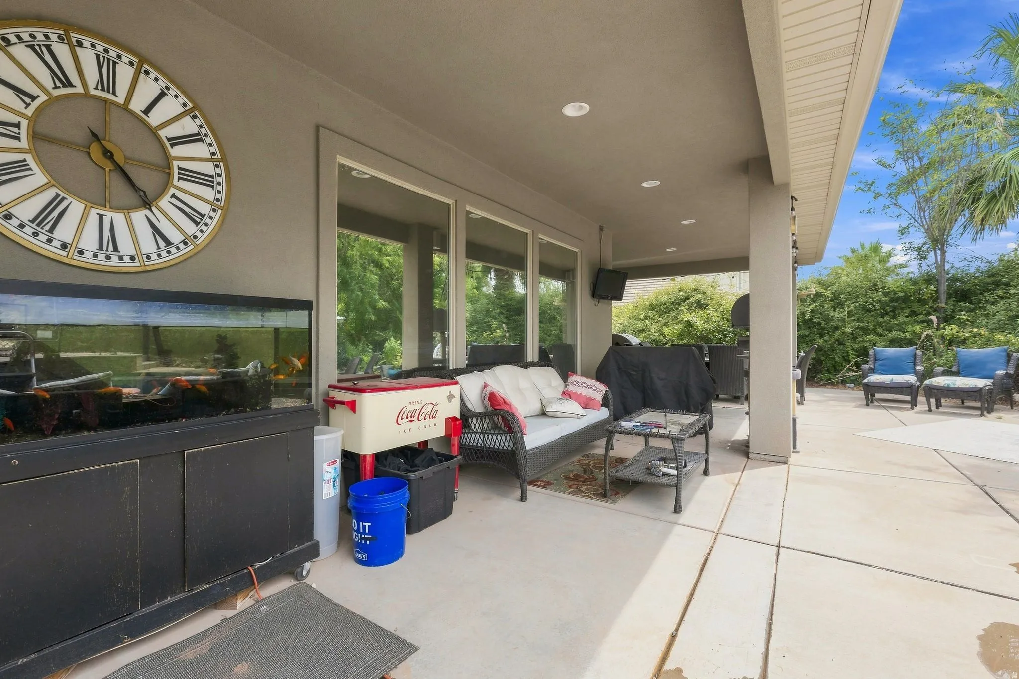 Covered outdoor patio with a large concrete surface