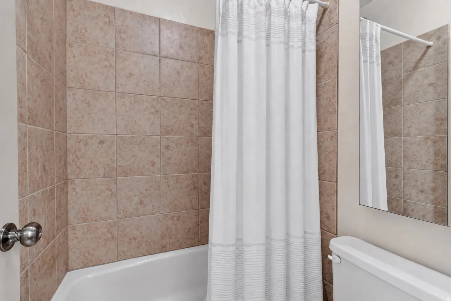 Shower/tub combination with ceramic tile surround