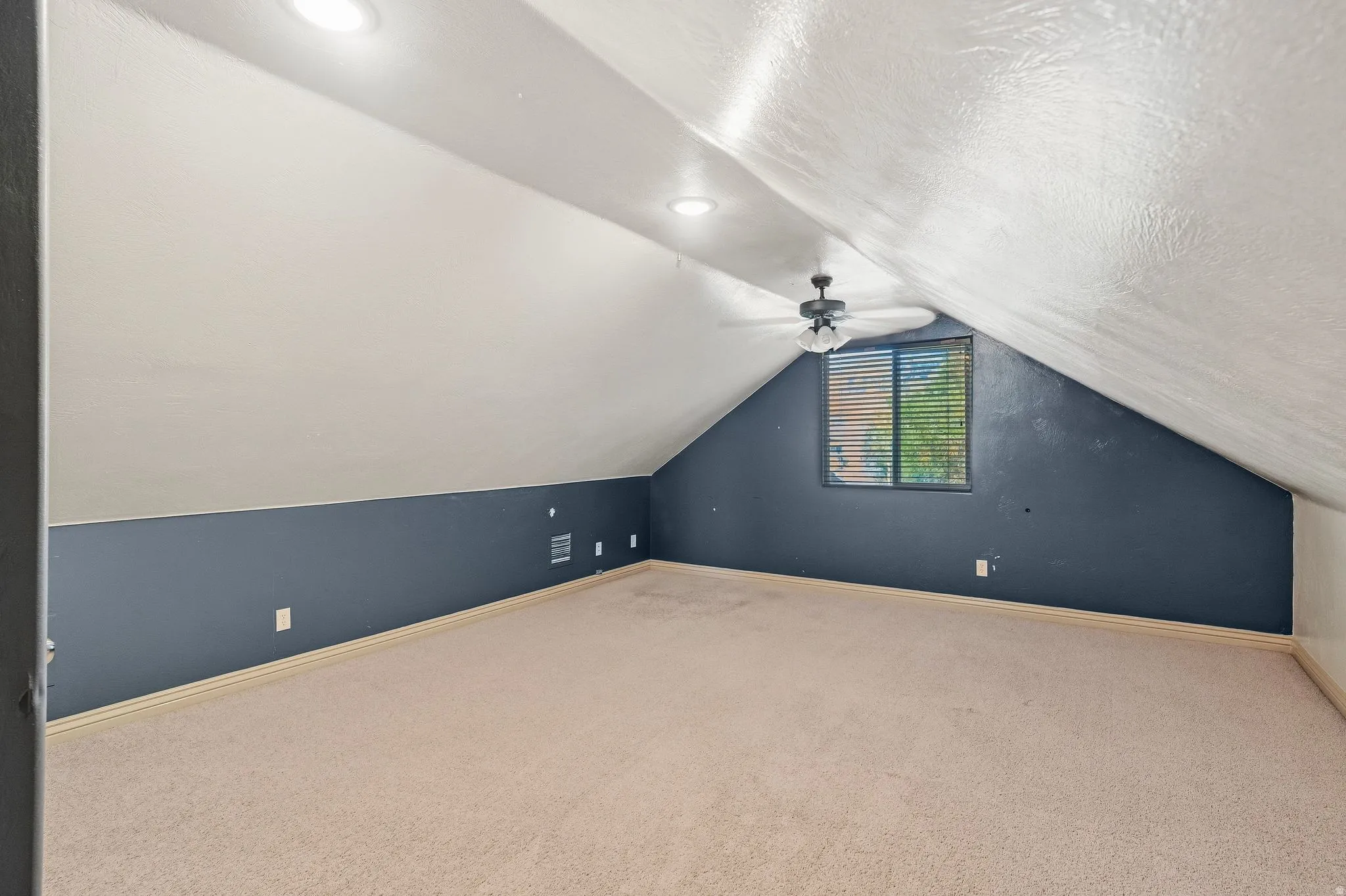 Sloped ceiling design with recessed lighting