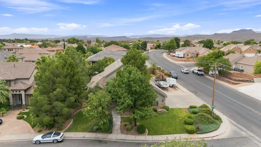 Expansive neighborhood featuring residential properties with pitched roofs, mature trees, and landscaping
