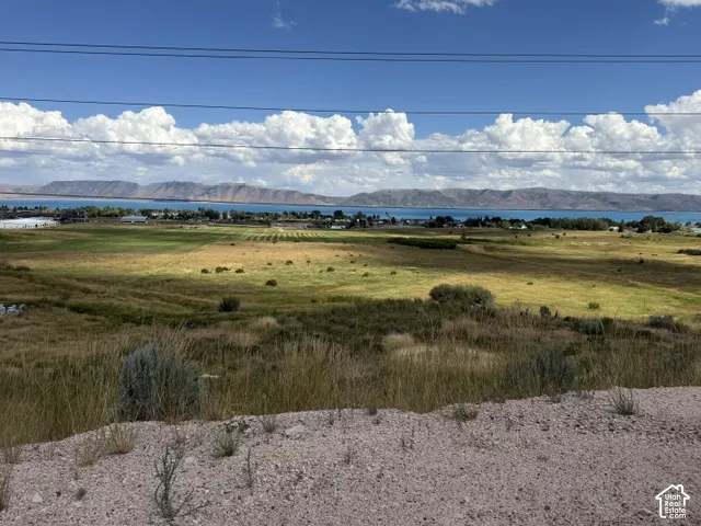 Expansive undeveloped land featuring natural terrain and distant water views