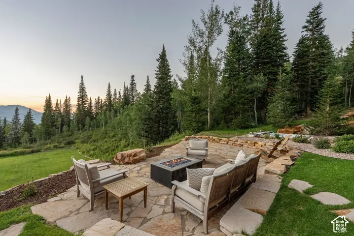 Expansive flagstone patio with a built-in fire pit