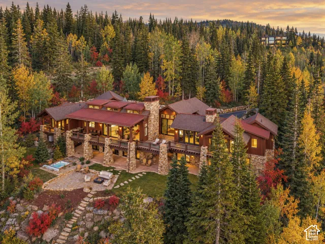 Expansive multi-level residence with stone and wood exterior finishes