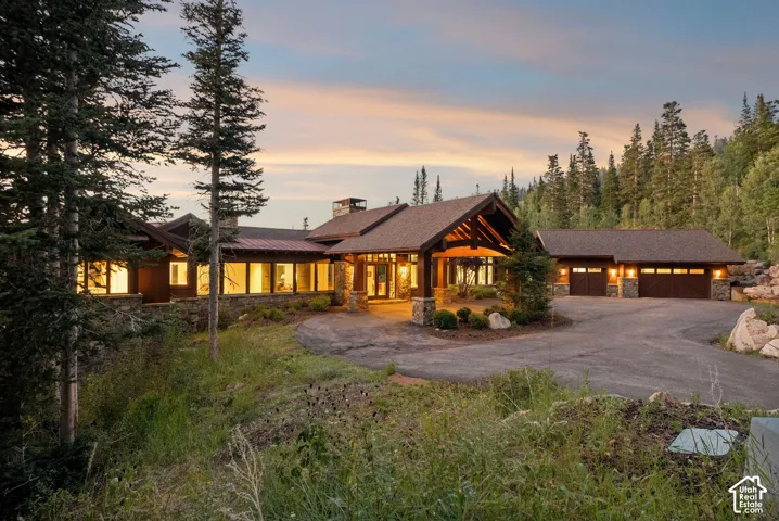 Stone and wood-sided exterior with a natural stone foundation