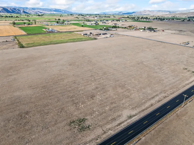 Expansive undeveloped land featuring a paved roadway