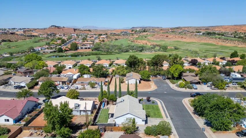Aerial view showcasing this residence situated on a generous lot within an established neighborhood