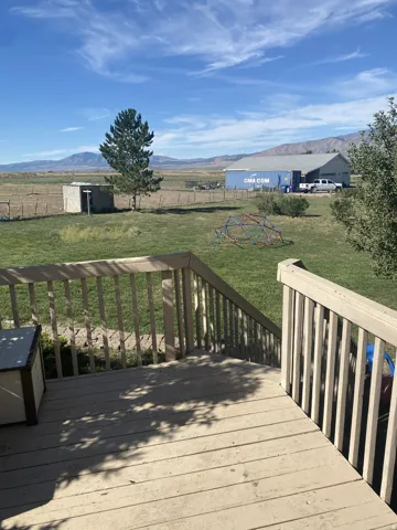 Looking out the back door, outdoor decking with railing