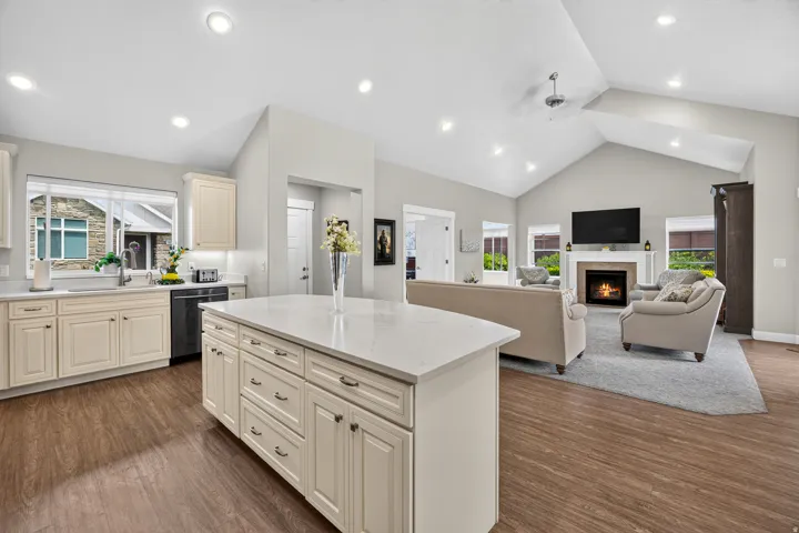 Kitchen featuring a center island with countertop, recessed lighting, and wood-finish flooring