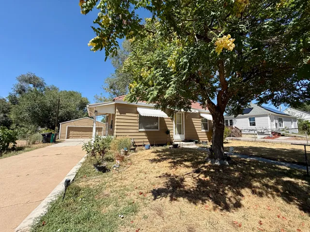 Single-story residence featuring horizontal siding, a covered entry, and a side-gabled roof