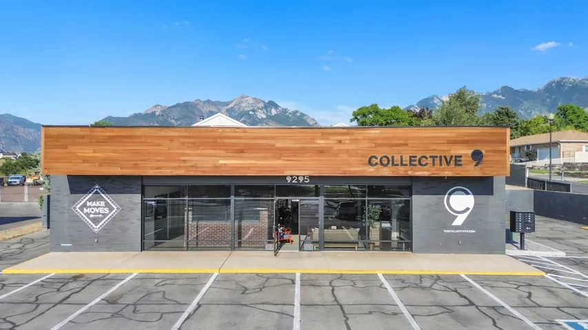 Modern storefront featuring a wood-finish facade and large glass display windows