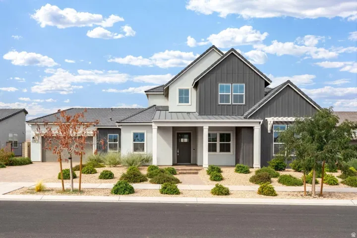 Contemporary architecture featuring a multi-gabled roofline and a two-car garage