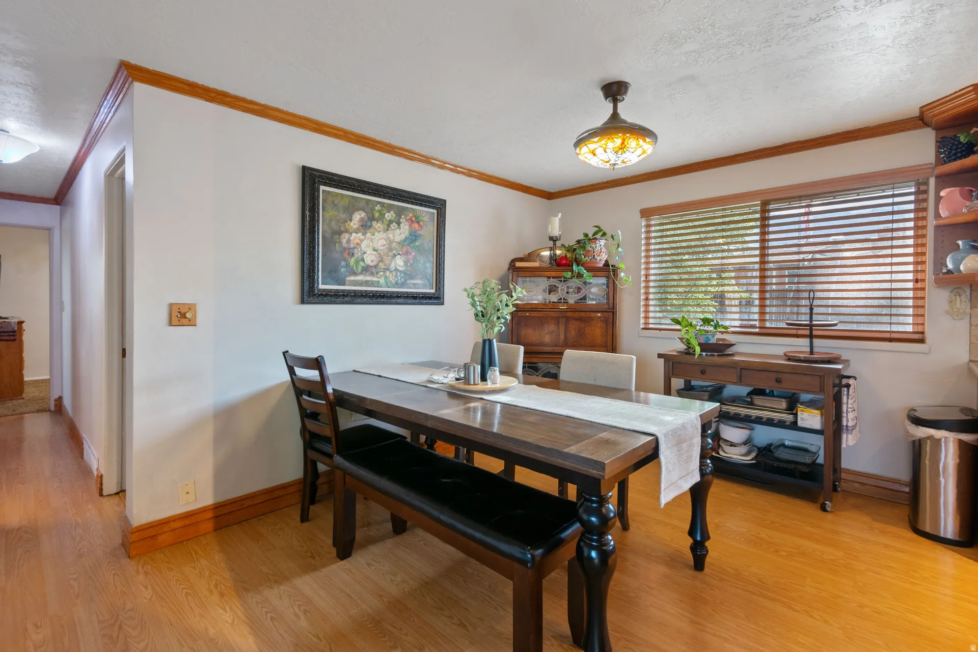 Wood-finish flooring with coordinating wood trim and crown molding