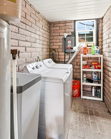 Brick wall construction with a white paneled ceiling
