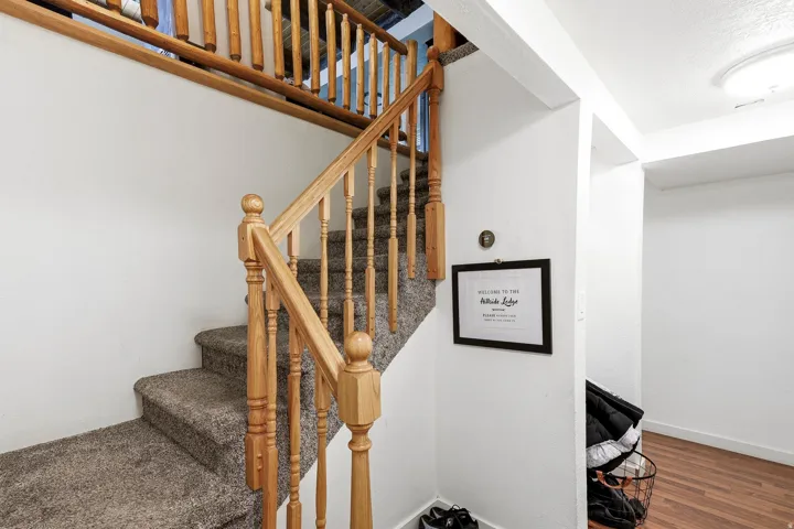 Hardwood flooring and a flush-mount ceiling light fixture