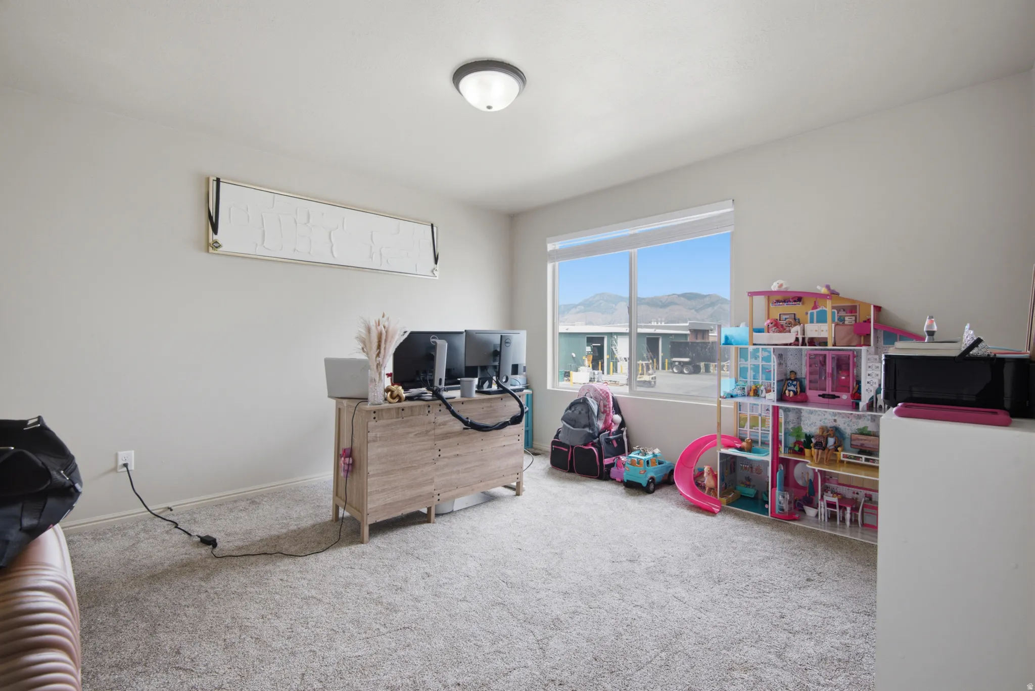 Carpeted flooring, neutral wall tones, recessed window, and flush mount ceiling light