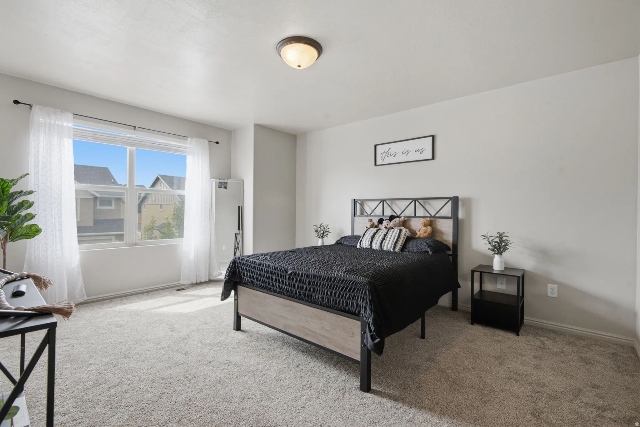 Broadloom carpet flooring, recessed window, flush mount ceiling light fixture, neutral wall paint, and white trim