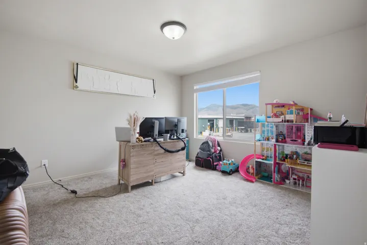 Carpeted flooring, neutral wall tones, recessed window, and flush mount ceiling light