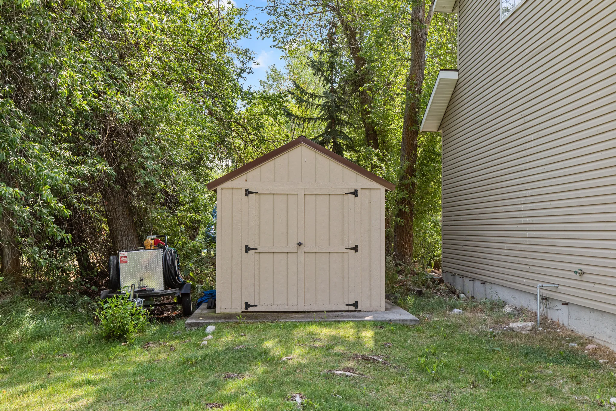 Storage shed with double doors and black hardware