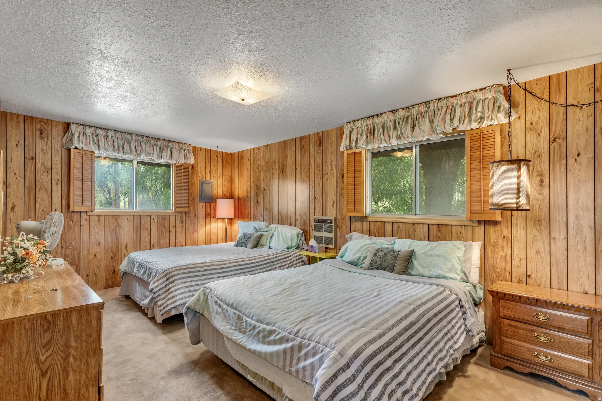 Wood-paneled walls and a textured ceiling