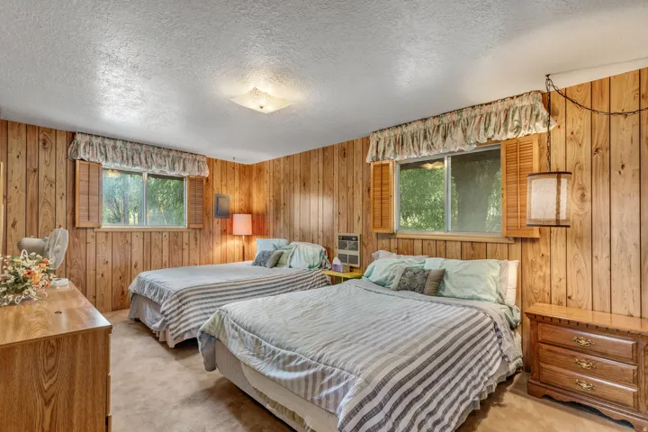 Wood-paneled walls and a textured ceiling