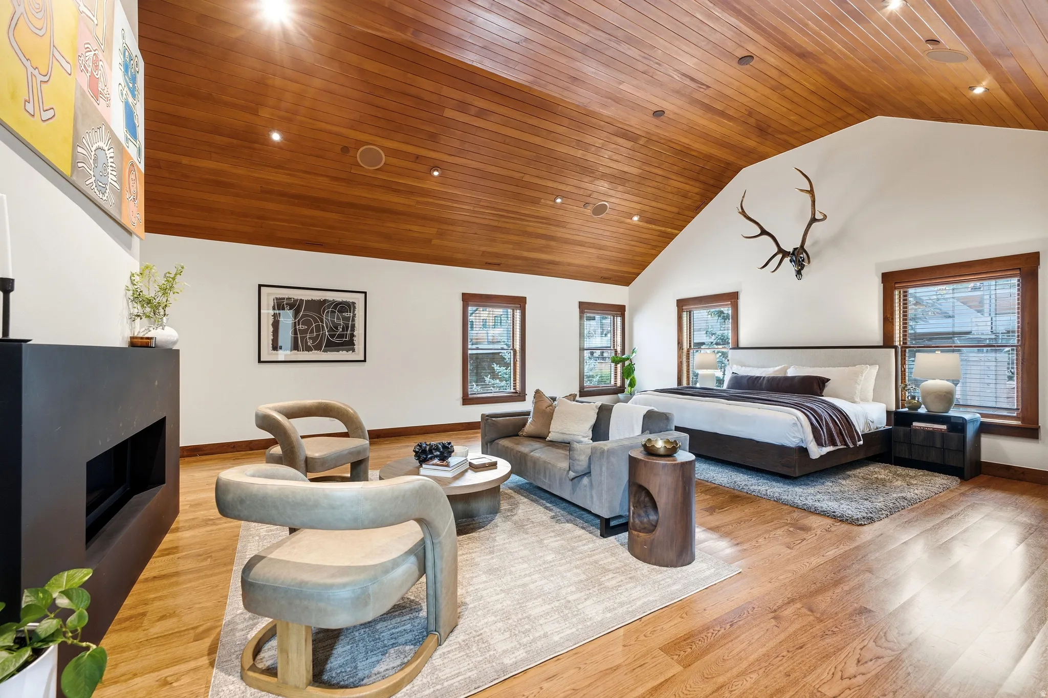 Vaulted wood-paneled ceiling with recessed lighting