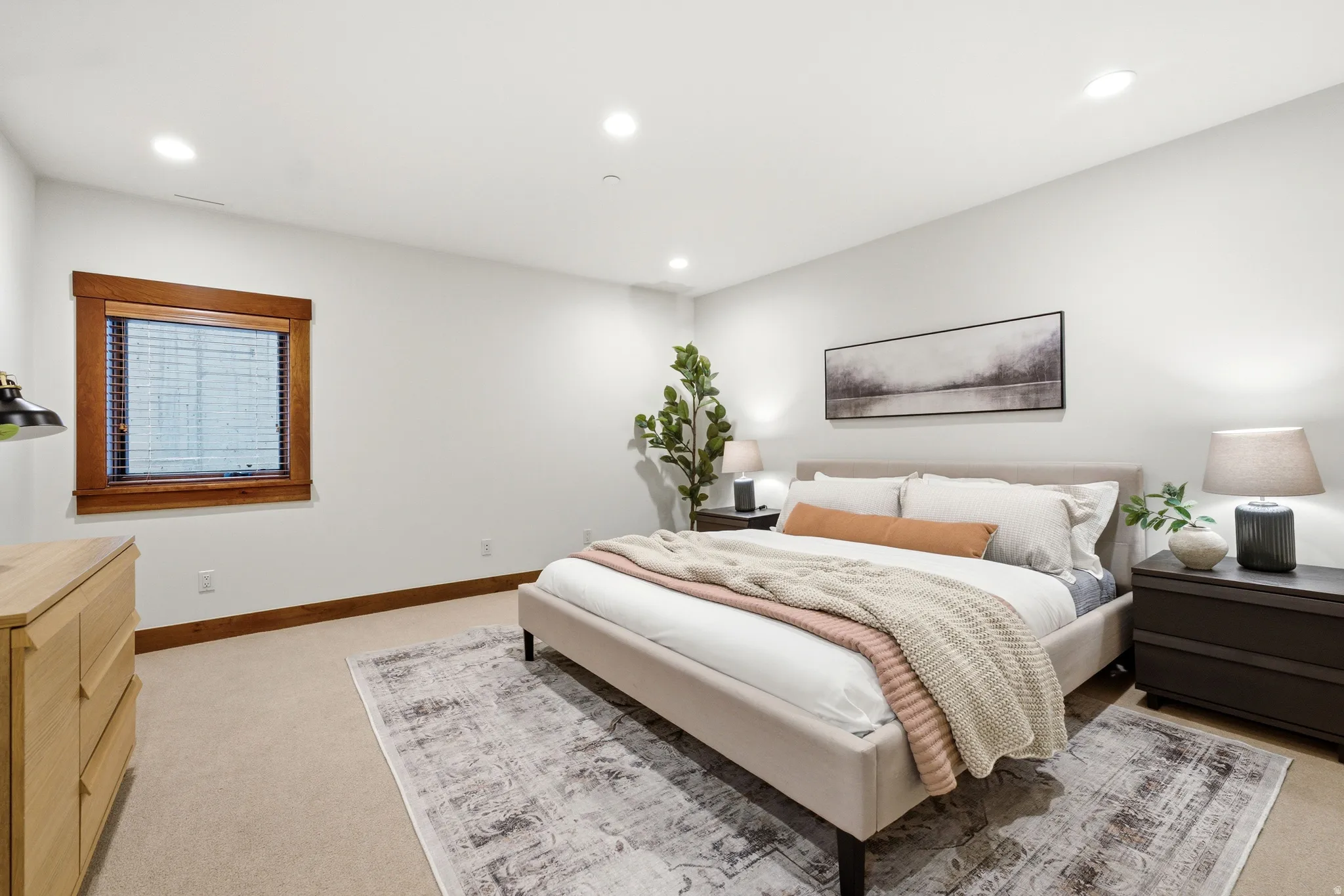 Recessed lighting, wood-trimmed window, and wall-to-wall carpeting