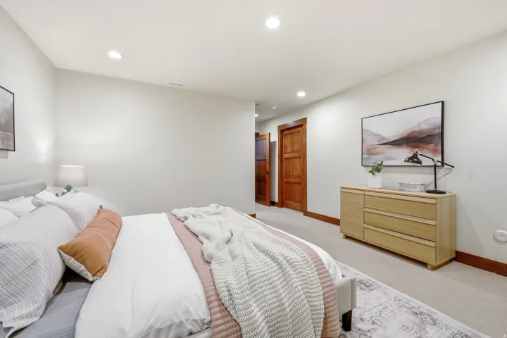 Recessed ceiling lights illuminate neutral-toned walls