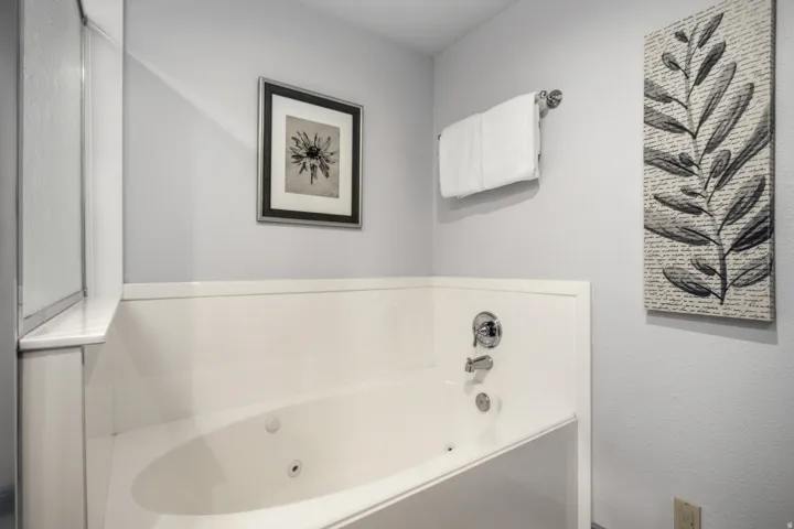 Jetted soaking tub with chrome fixtures