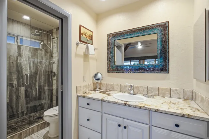 Spacious vanity with a light-colored countertop and integrated sink