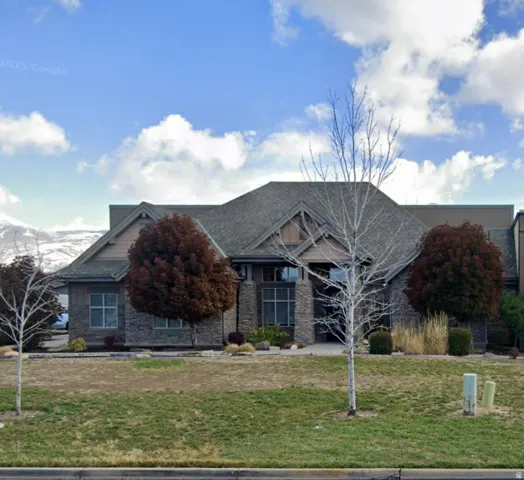 Stone and siding exterior with a multi-gabled roofline