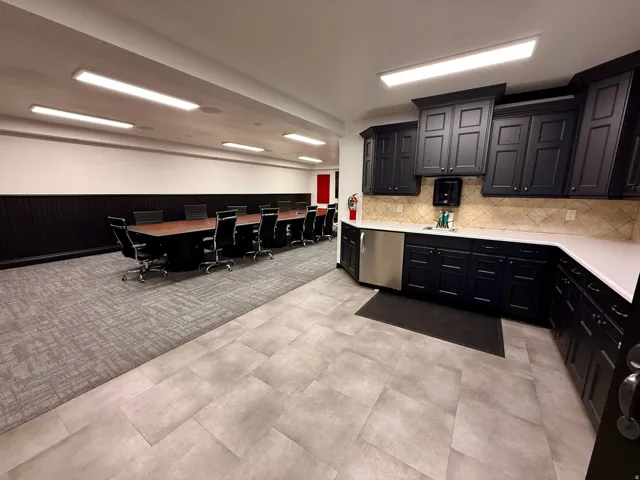 Recessed lighting and a tile flooring enhance this functional space