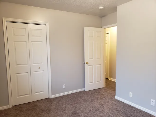 Neutral gray wall paint and white trim details
