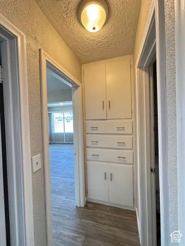 Built-in hallway cabinetry with four drawers and two lower cabinets